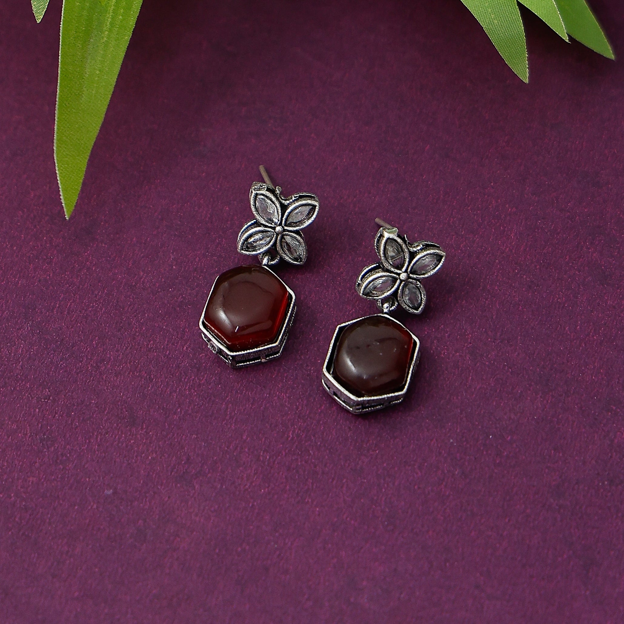 Elegant geometric floral earrings with stone detailing