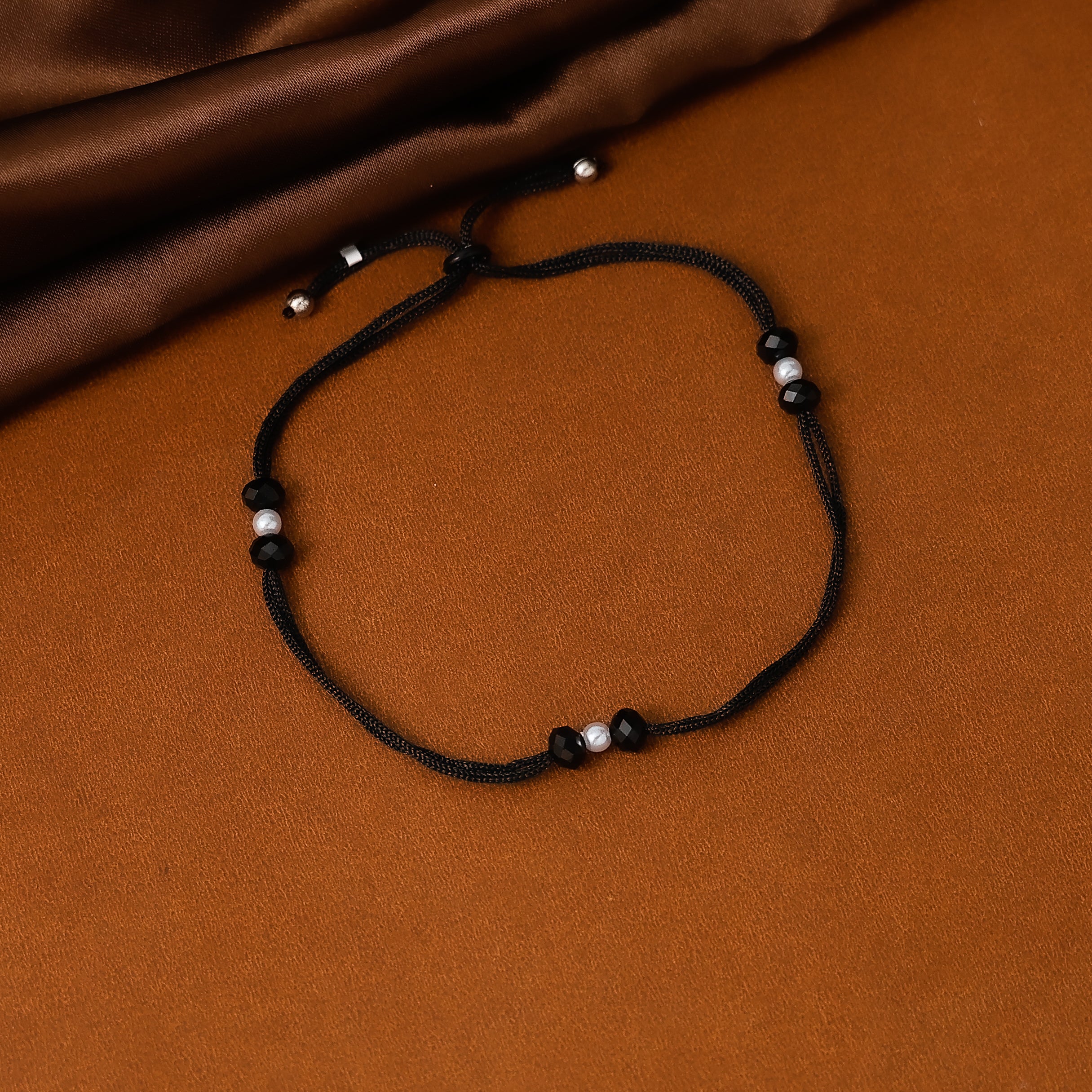 Adjustable black thread anklet for casual styling