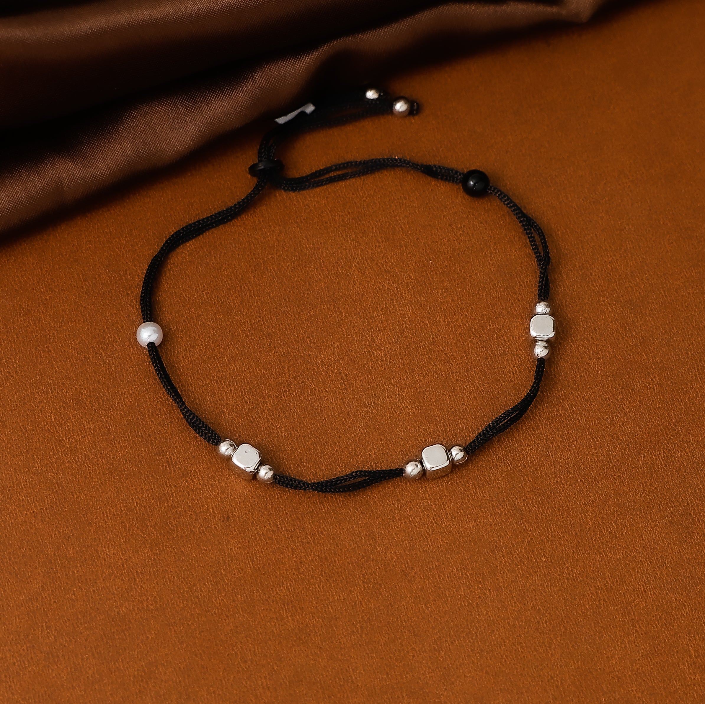 Traditional nazar style black thread anklet