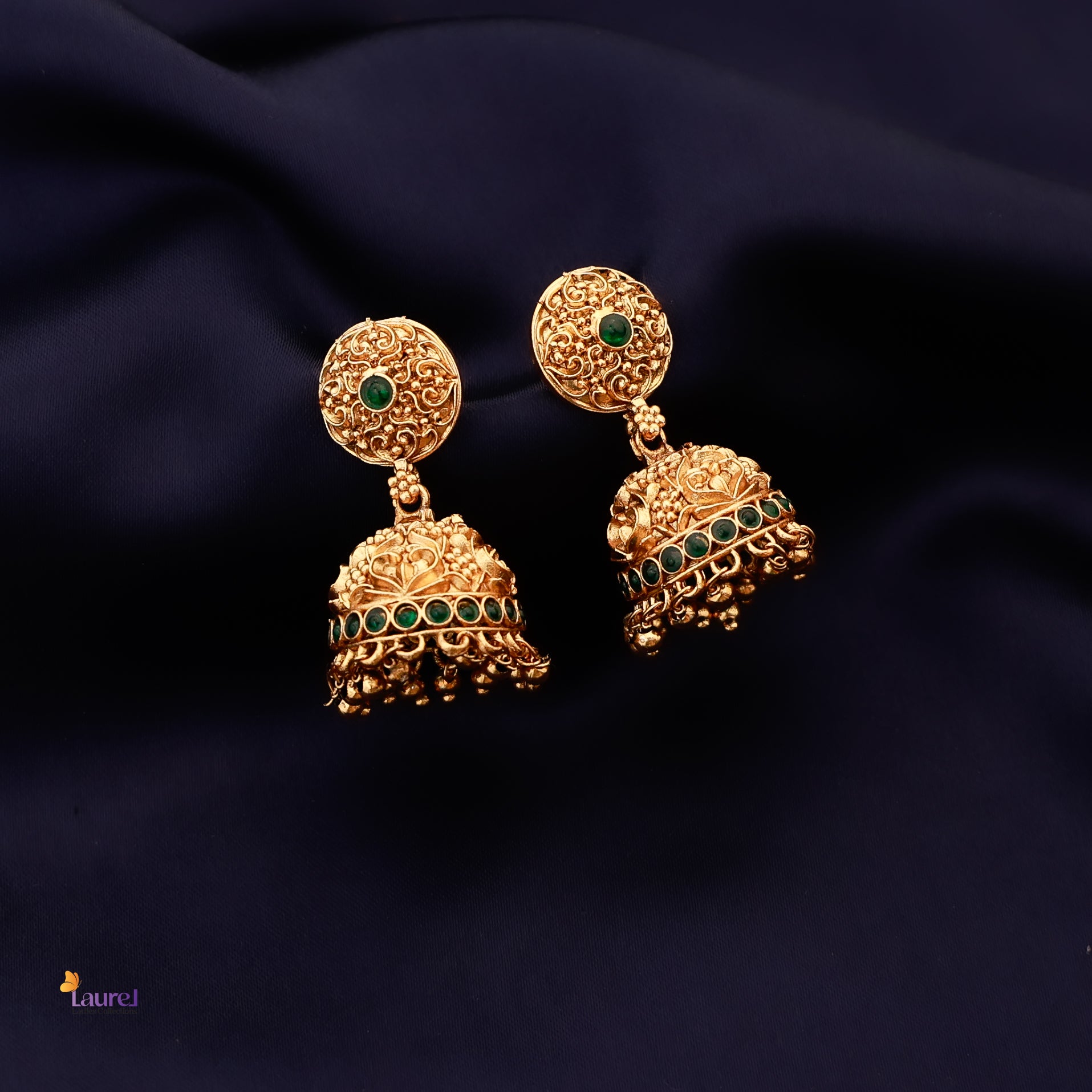 Traditional gold-tone jhumka earrings with green stones