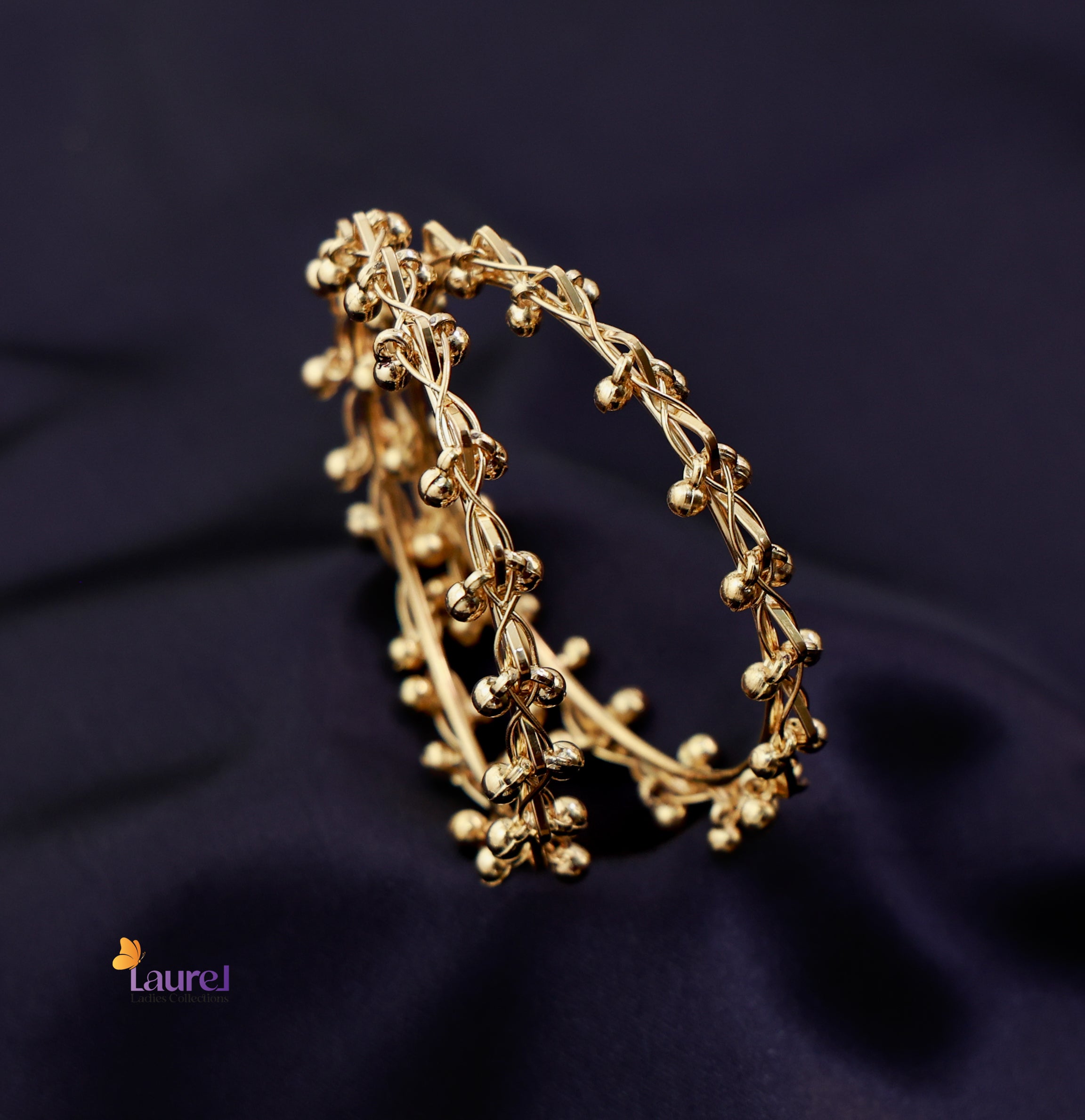 Traditional Kashmiri gold plated bangles close up
