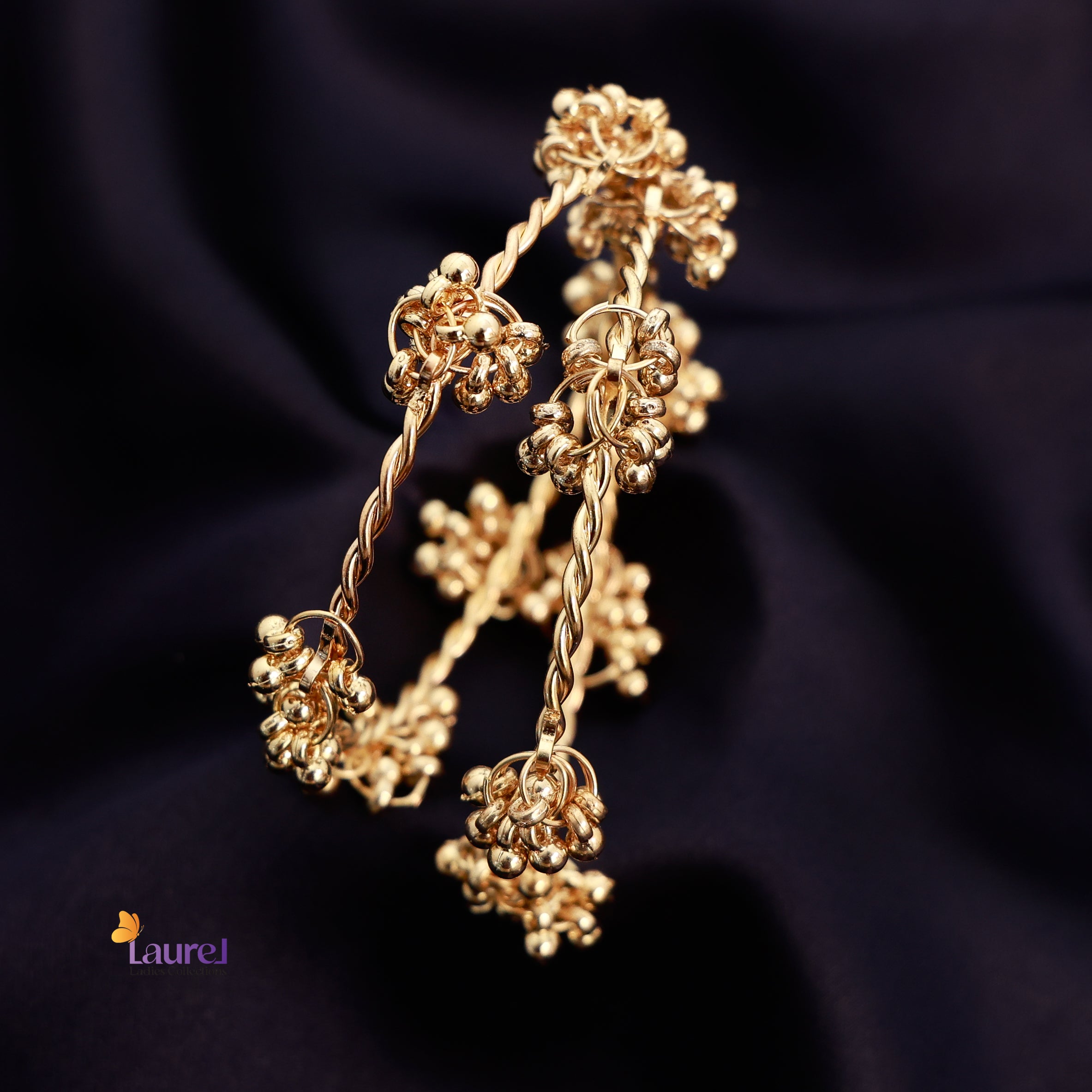 Gold tone Kashmiri ghungroo bangles close up
