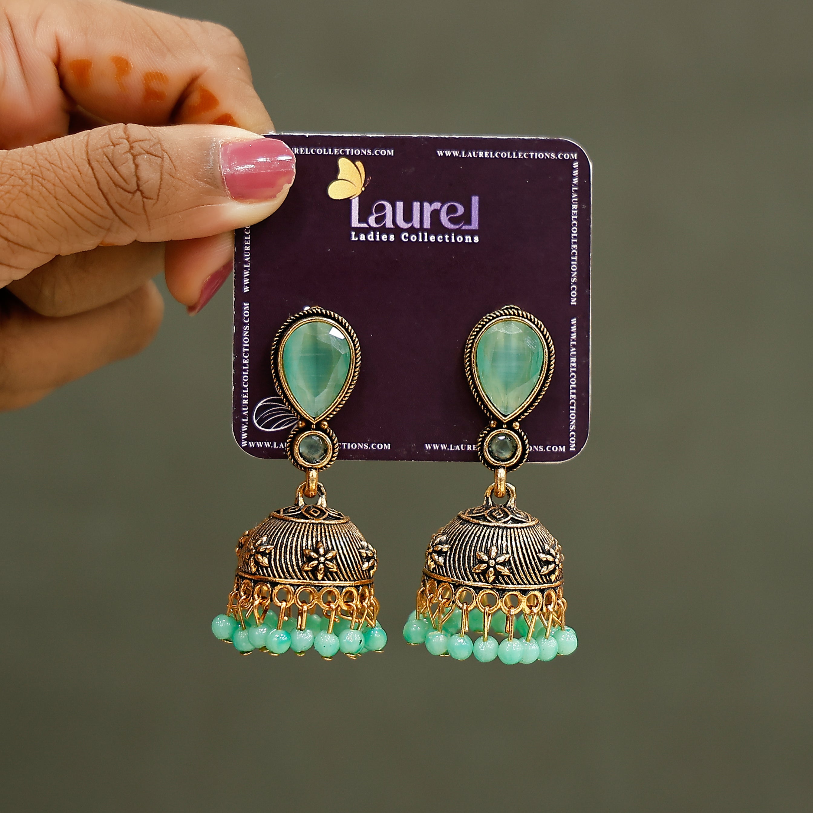 Ocean green beaded jhumkas with elegant traditional design