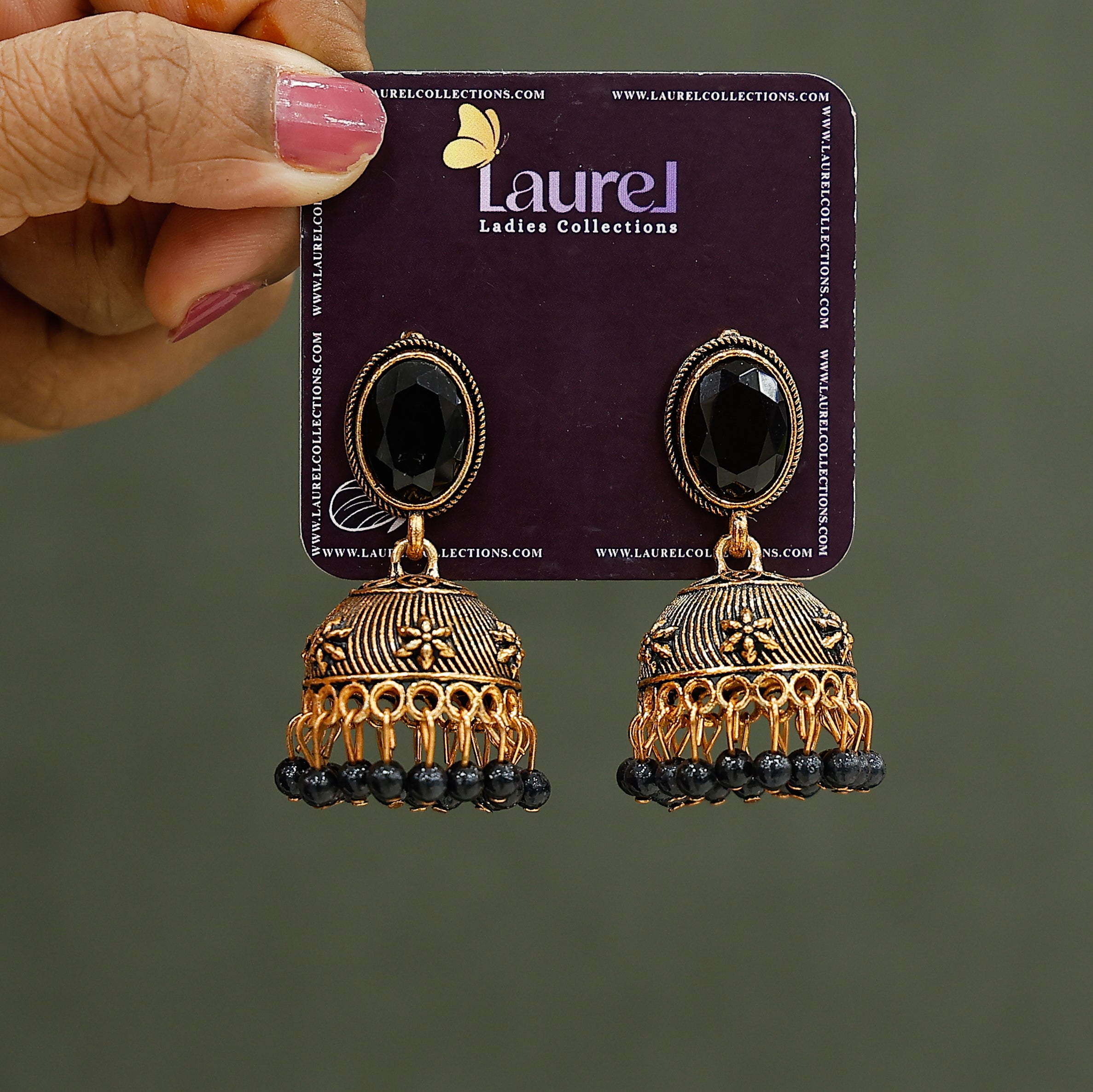 Stylish golden jhumkas with black pearl detailing