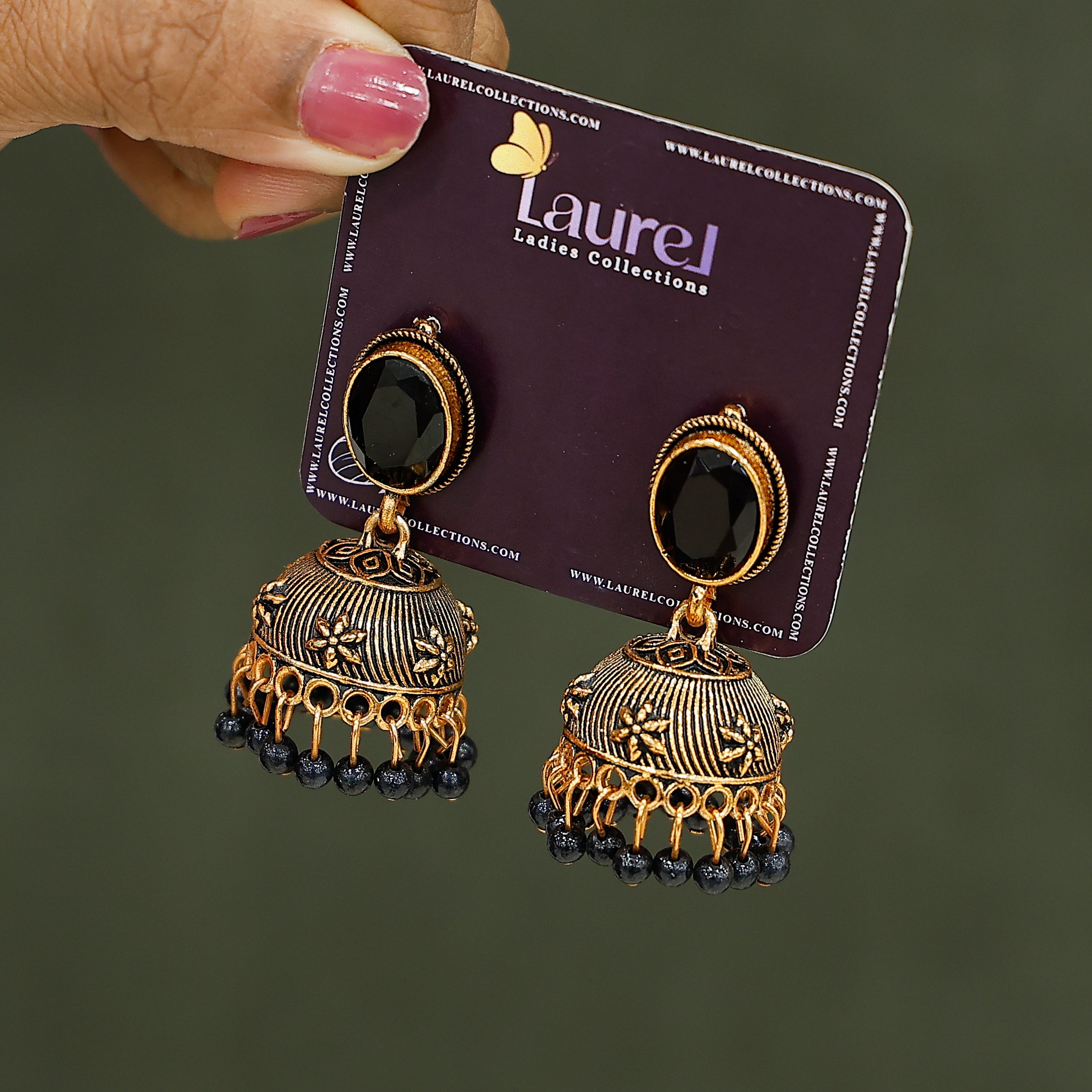 Elegant black pearl jhumka earrings with golden finish
