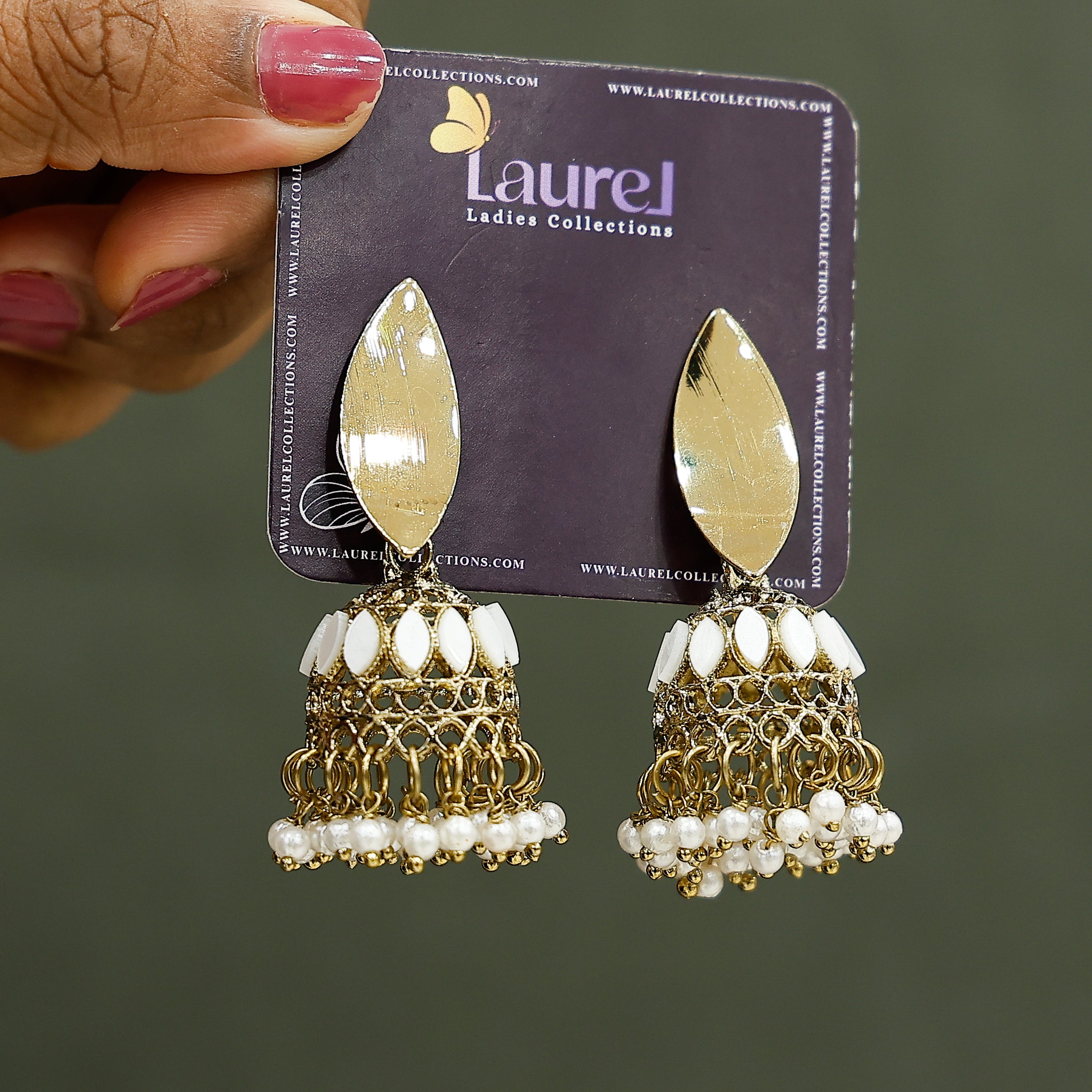 Traditional pearl golden jhumkas close-up view
