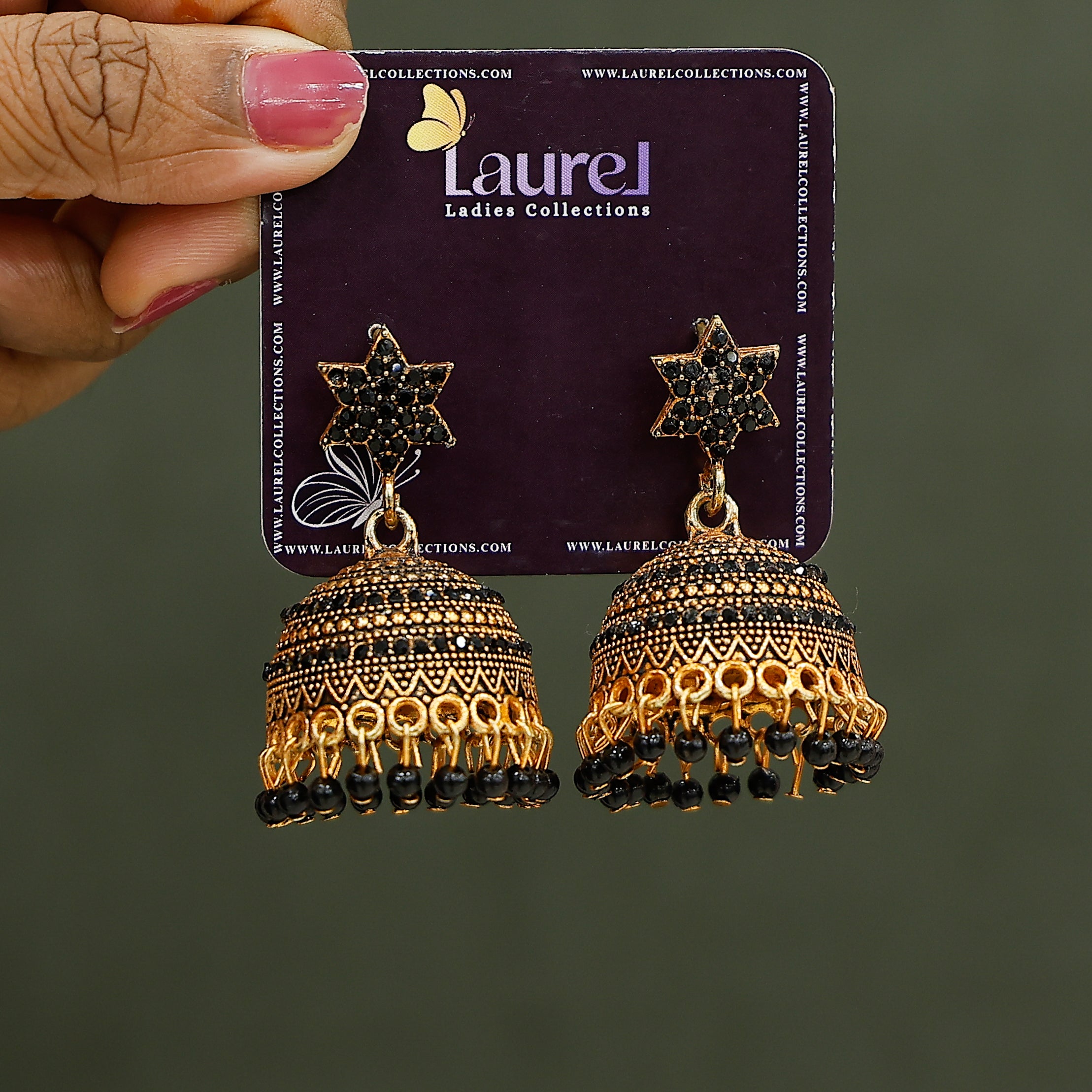 Elegant ethnic jhumkas with star design and black beads