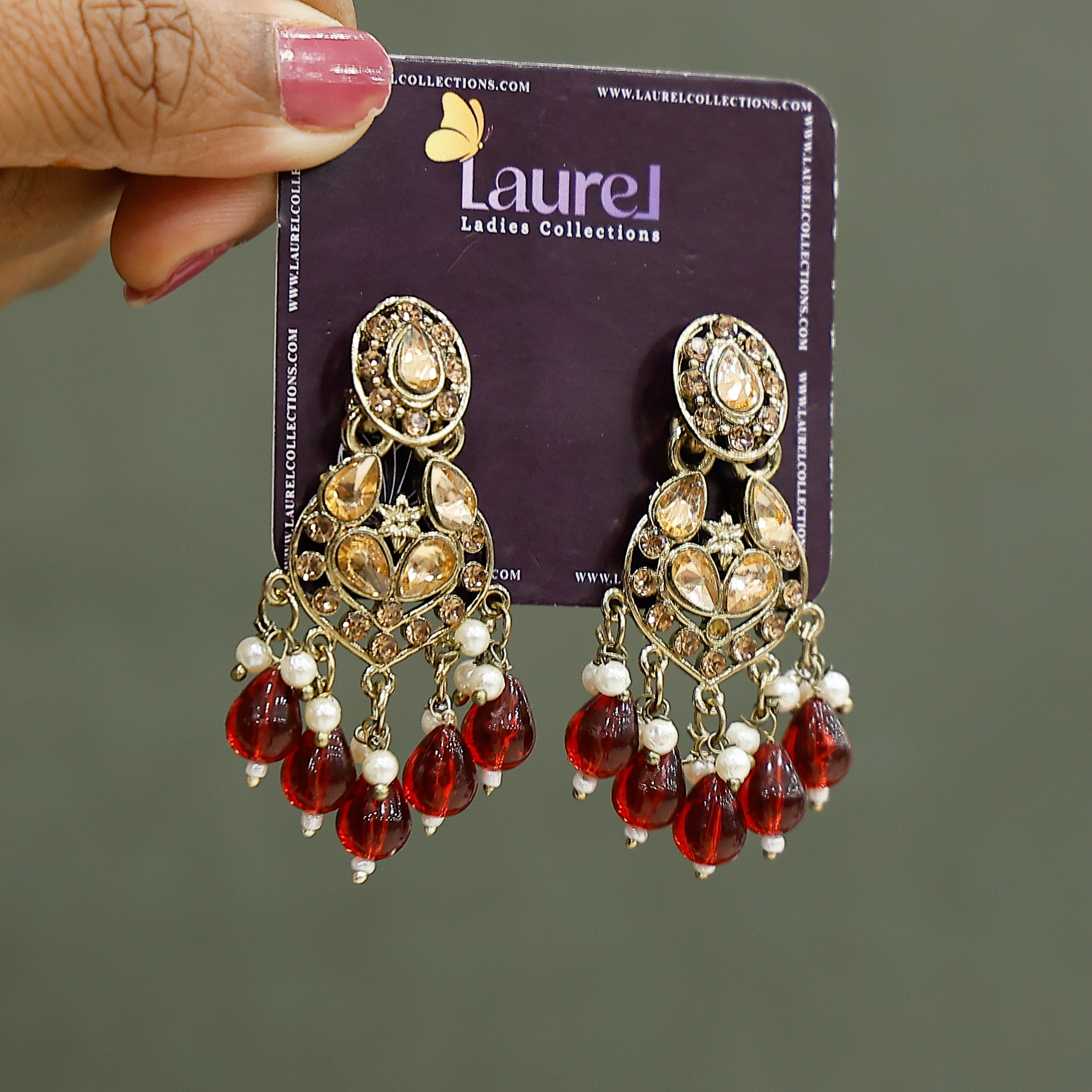 Elegant maroon party wear danglers close-up view