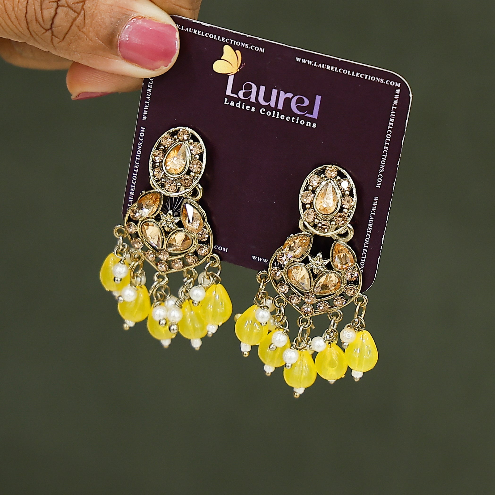 Elegant yellow party wear dangling earrings close-up