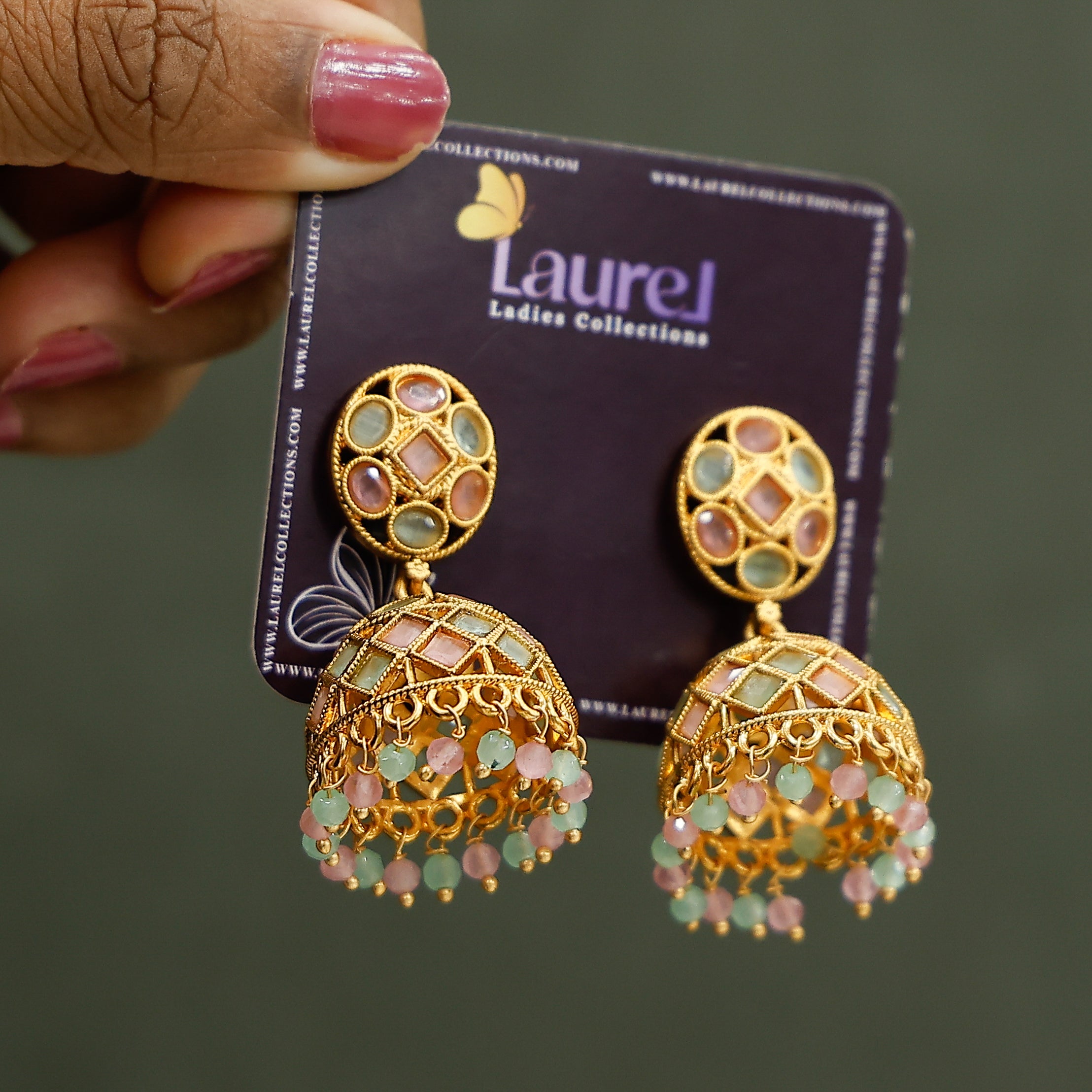Elegant pastel jhumka earrings with bead detailing