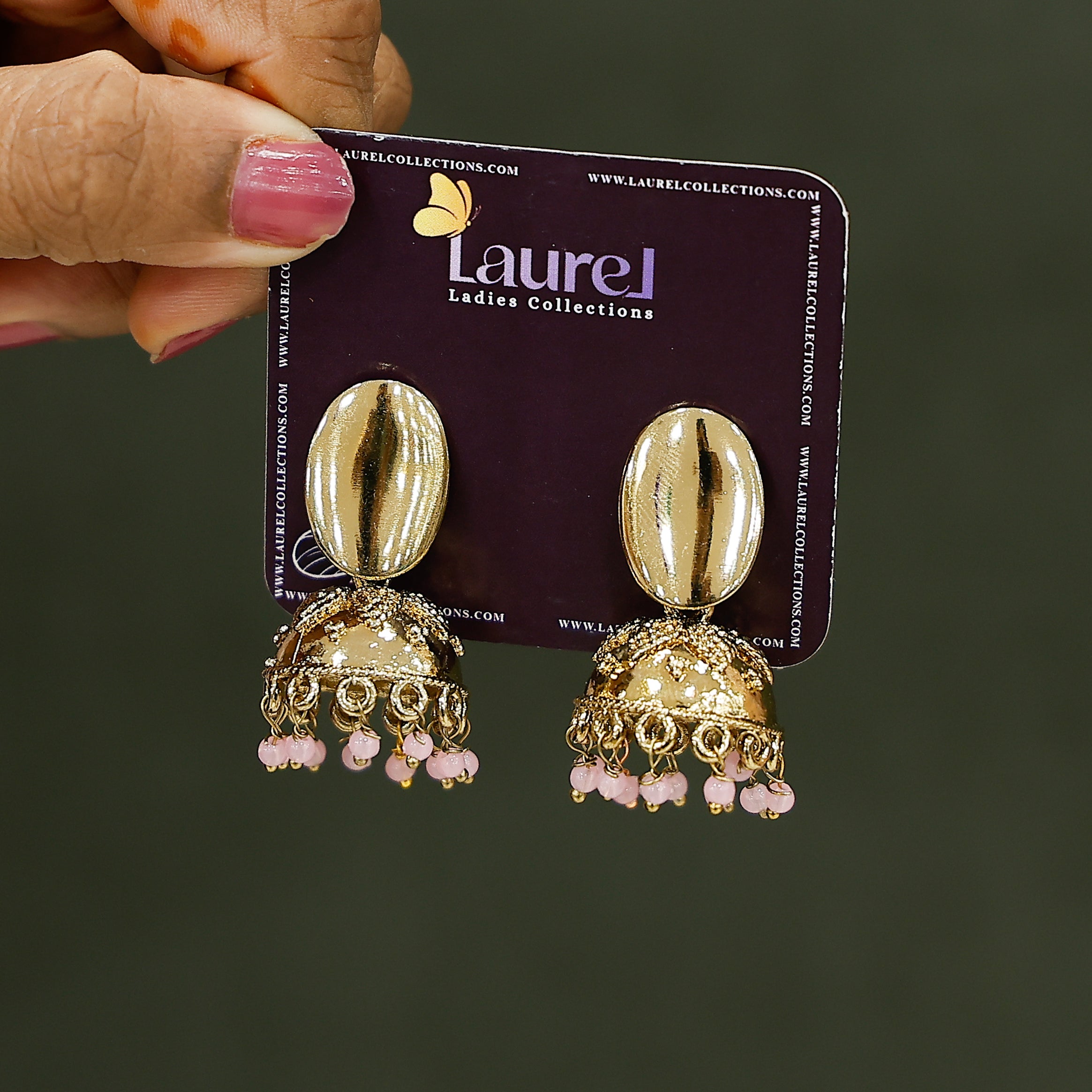 Stylish pink and gold bead earrings close-up view