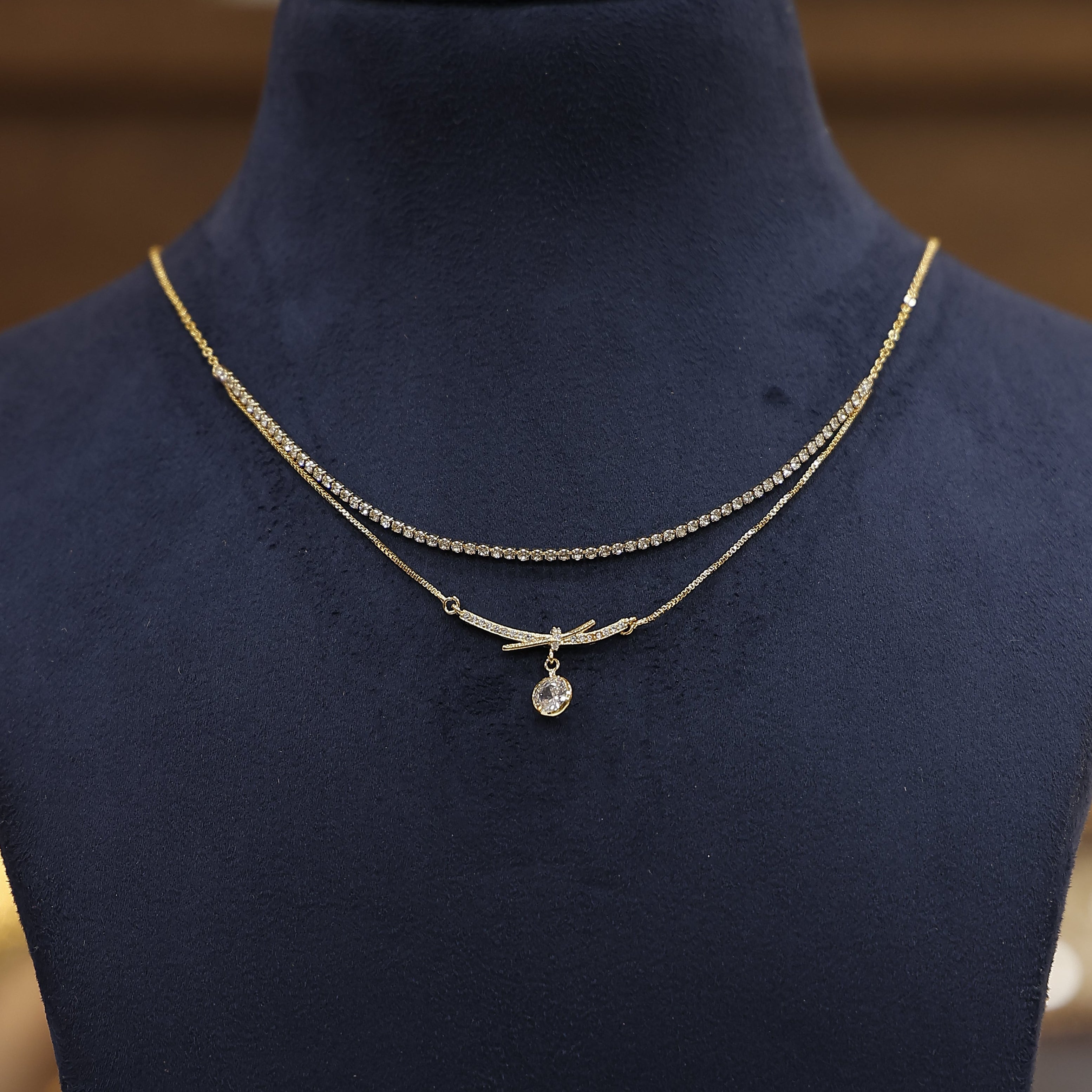 Dangling zircon charm chain necklace with sparkling stone detailing