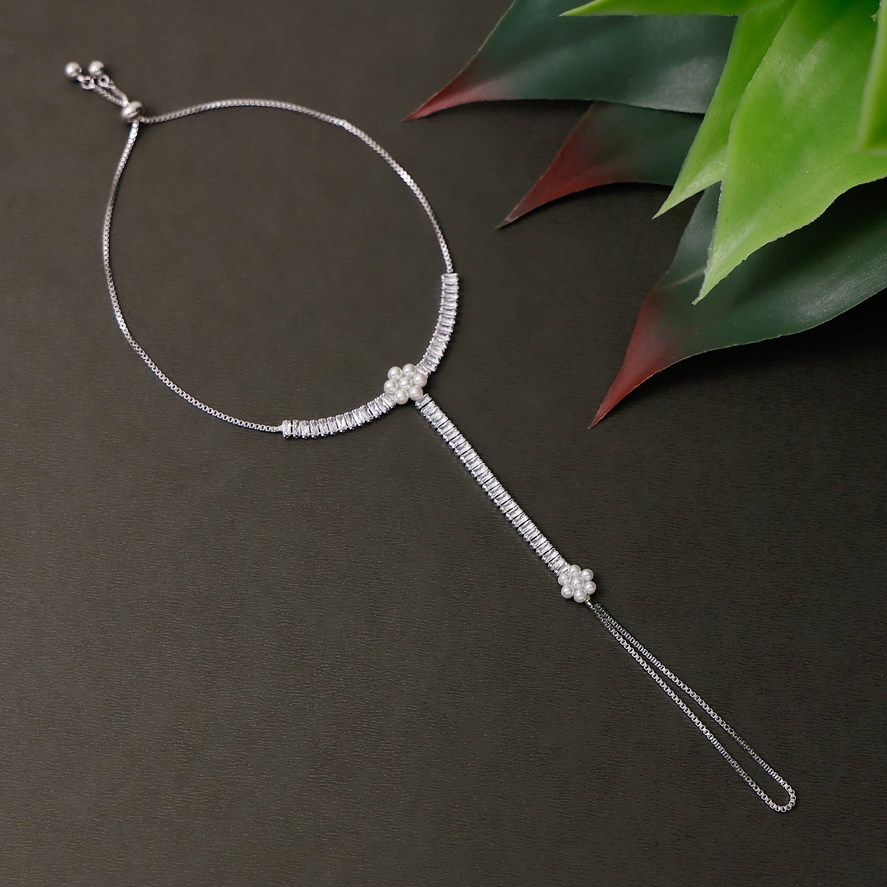 Gold tone pearl hath pan with bracelet and ring chain design