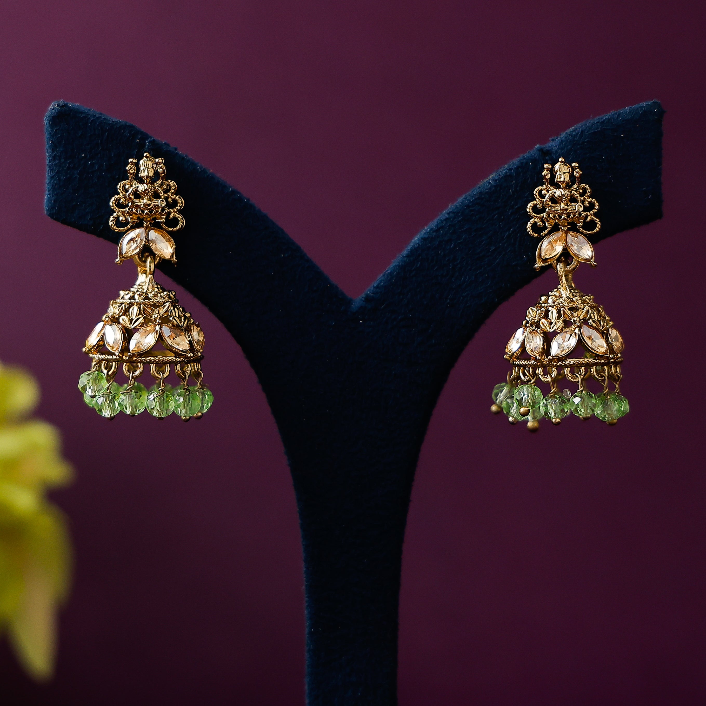 Stone beaded jhumka earrings with antique gold finish