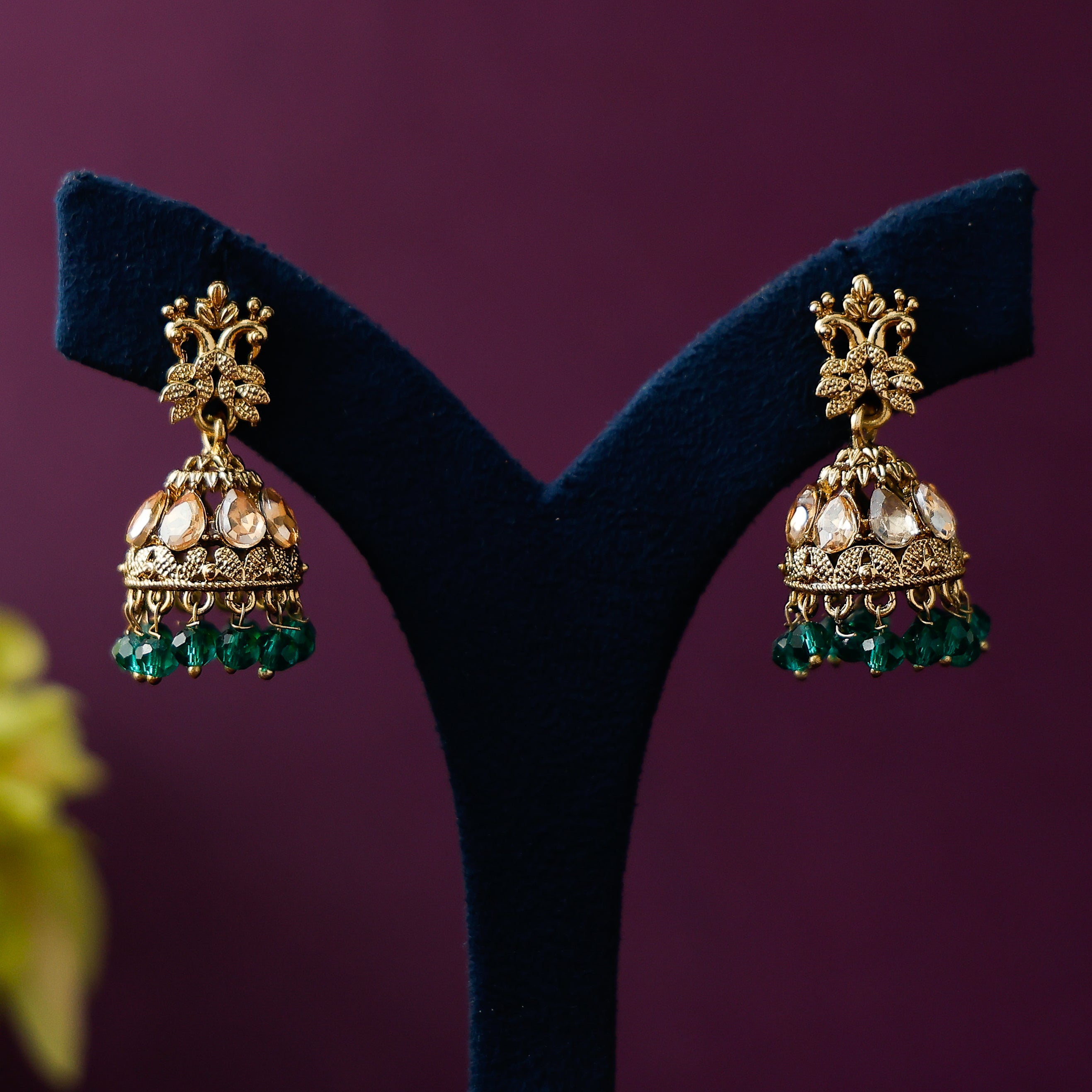 Stone beaded jhumka earrings with antique gold finish