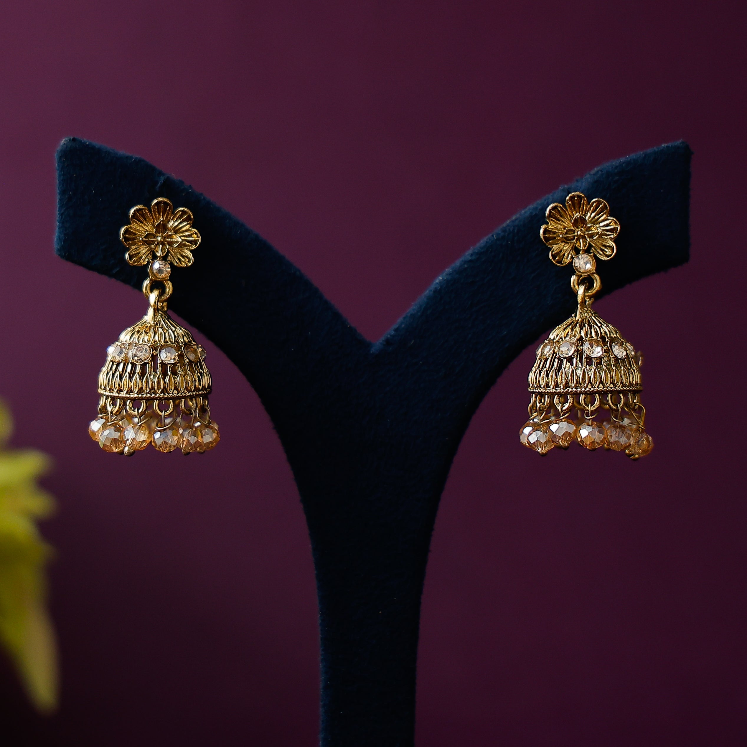 Traditional floral jhumka earrings with bead accents