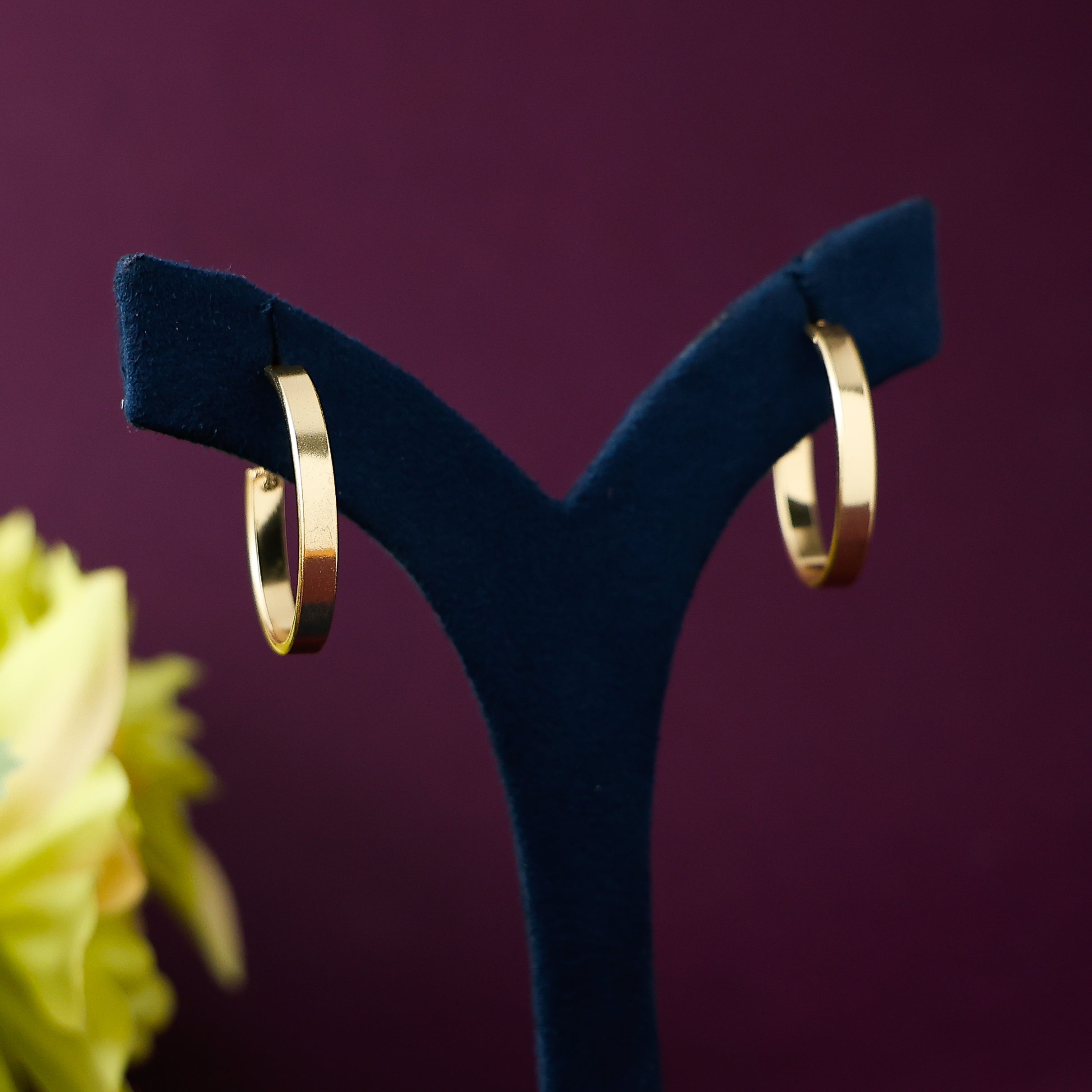Golden rounded hoop earrings for women with polished finish
