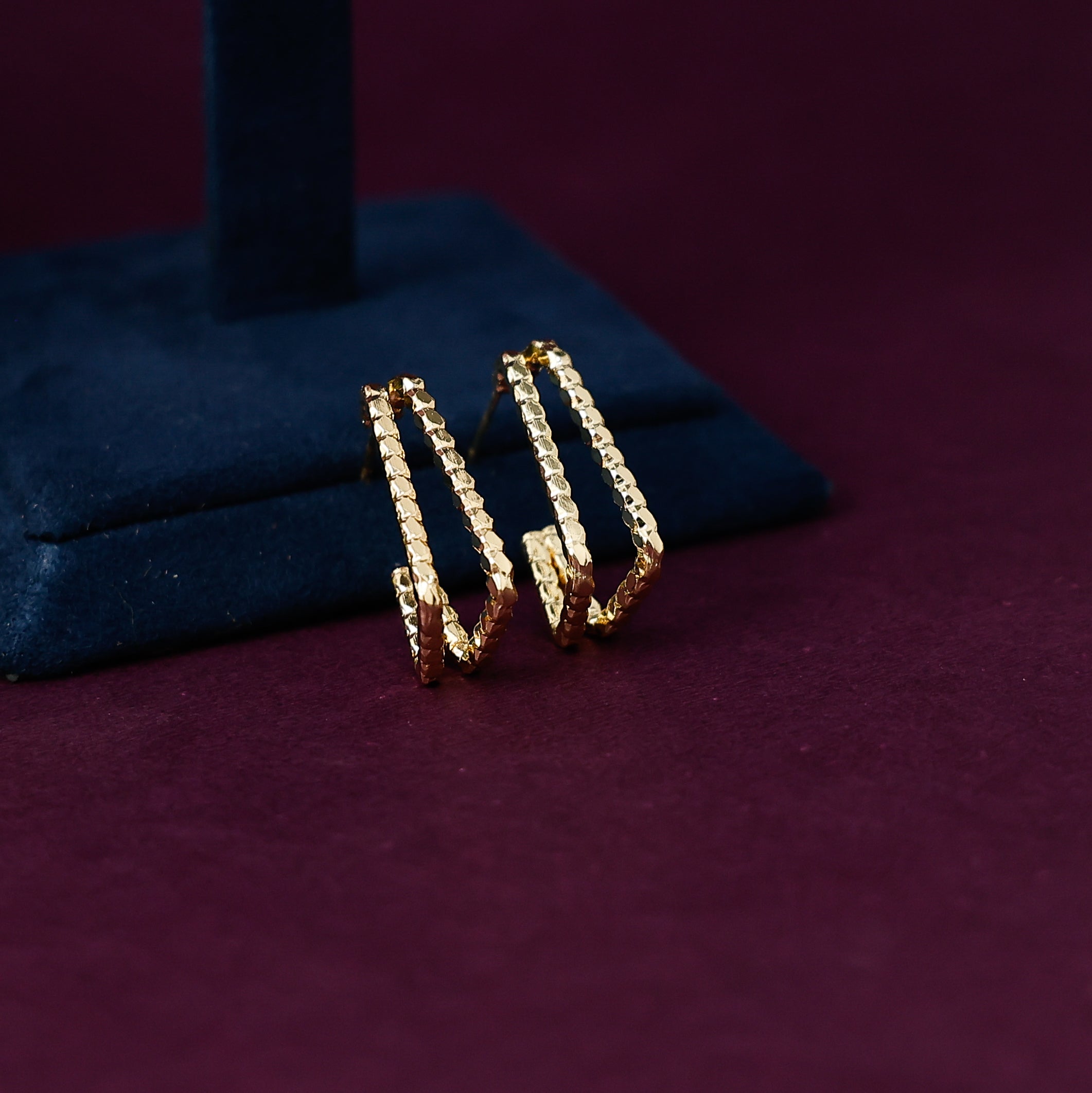 Textured golden hoop earrings for women with elegant finish
